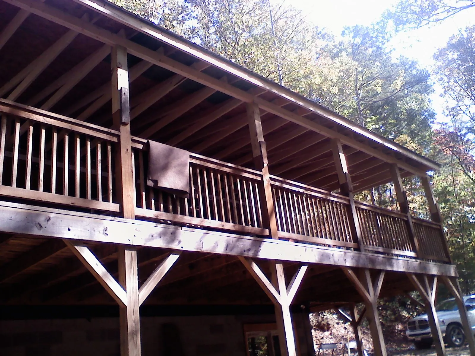 Timber framing under a new elevated porch and deck — Roof Leak Repair in Champaign by Roofing Brothers